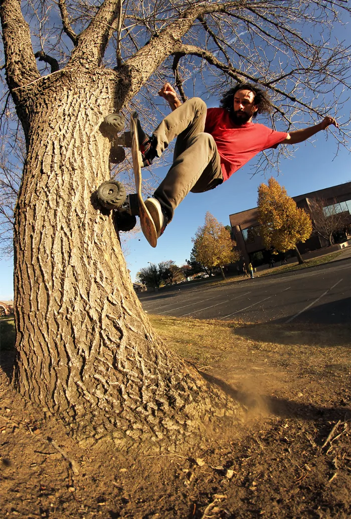 Donnie Mortensen performing a trick on a dirt mound with his off-road skateboard