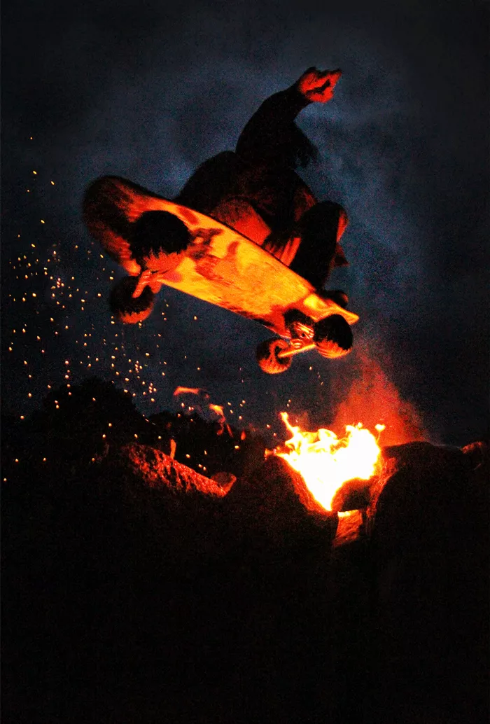 Donnie Mortensen performing a trick over a fire pit with his off-road skateboard