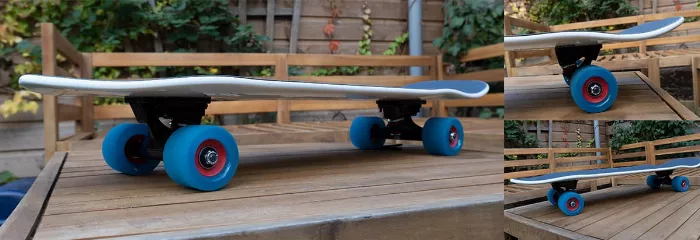 Fireball cruiser longboard with red wheels and natural wood deck