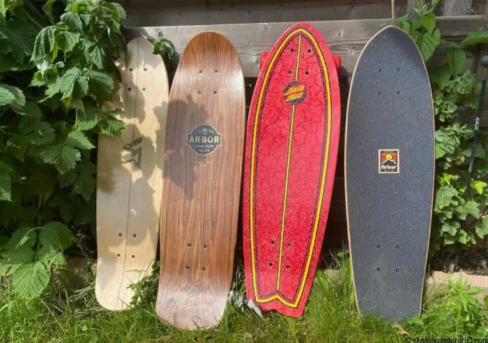 Four mini cruiser skateboards in a row