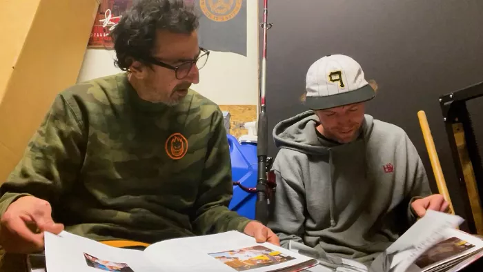 Frank Gerwer and Silas Baxter-Neal reviewing the Jenkem Vol. 3 book