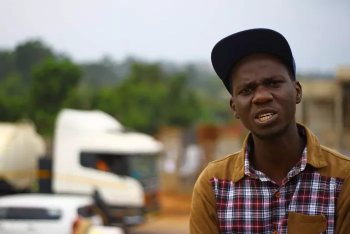 Gerald Gose, the founder of the Uganda Skateboard Society, posing for a portrait