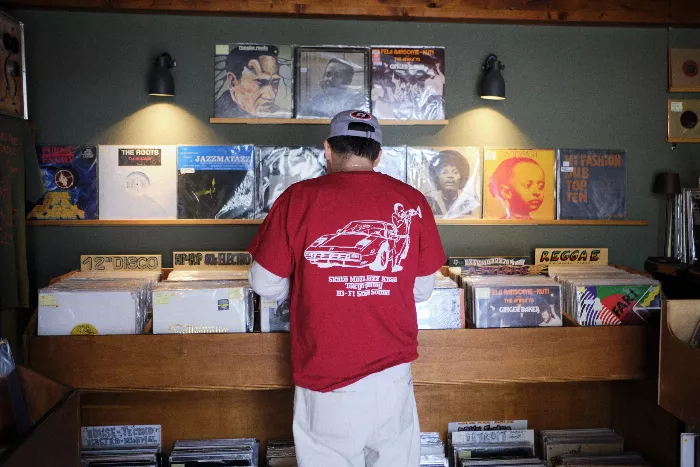 Gianluca Quagliano, host of Skate Muzik, posing with a record player.