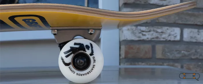 Girl skateboard wheels and deck close up