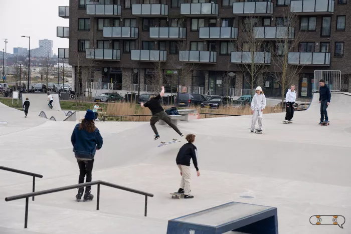 group of longboarders riding at a skatepark