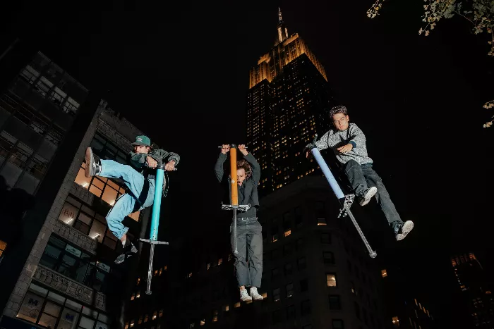 Henry Cabelus performs a trick on a pogo stick at a NYC skate spot.