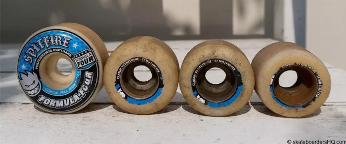 Image showing the difference between worn and new longboard wheels