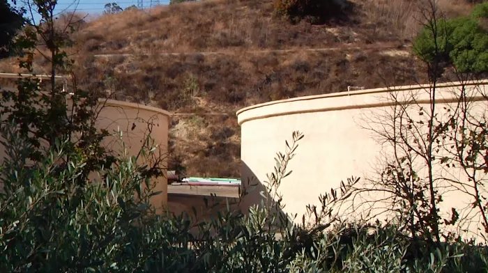 Jeremy Wray standing in between the two water towers where he performed the ollie