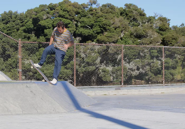 Jimmy Carlin, known for his energetic skateboarding style and humorous persona, captured during his professional skateboarding days