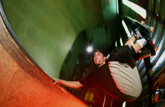 John Cardiel skating in 1996, captured by Grant Brittain, showcasing the raw energy and style of the era