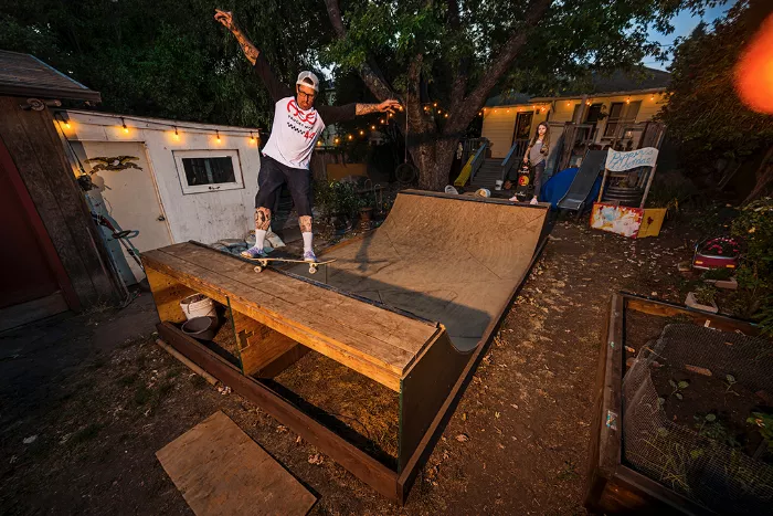 Josh and his daughter working on their mini ramp