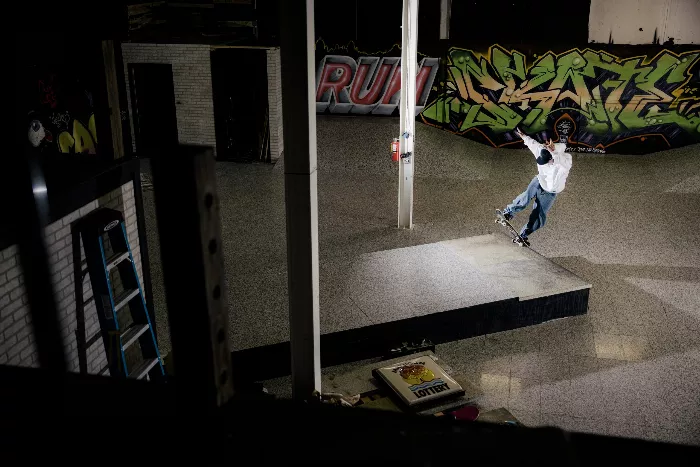 Josh Kalis performing a front blunt on a granite ledge at the new skatepark