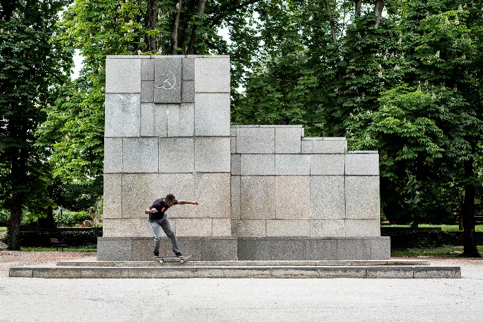 Keith Hardy skating in Bulgaria, captured with a wide-angle perspective showcasing an urban environment