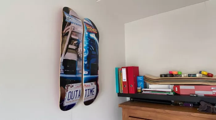 Longboard decks creatively hung on a wall as art