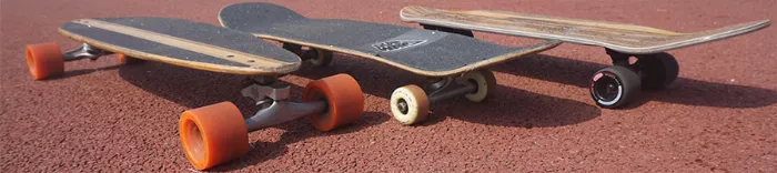 Longboard set up showing large deck, trucks and wheels