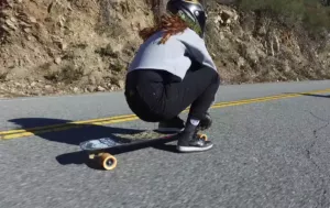 Longboarder performing a swiss footbrake