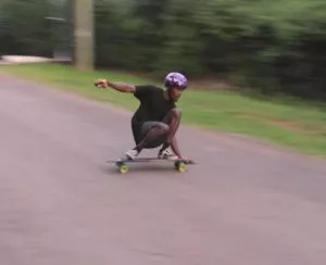 Longboarder sliding for safe cornering