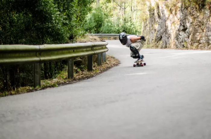 Longboarder speeding downhill