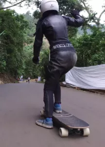 Longboarder using a stand up footbrake