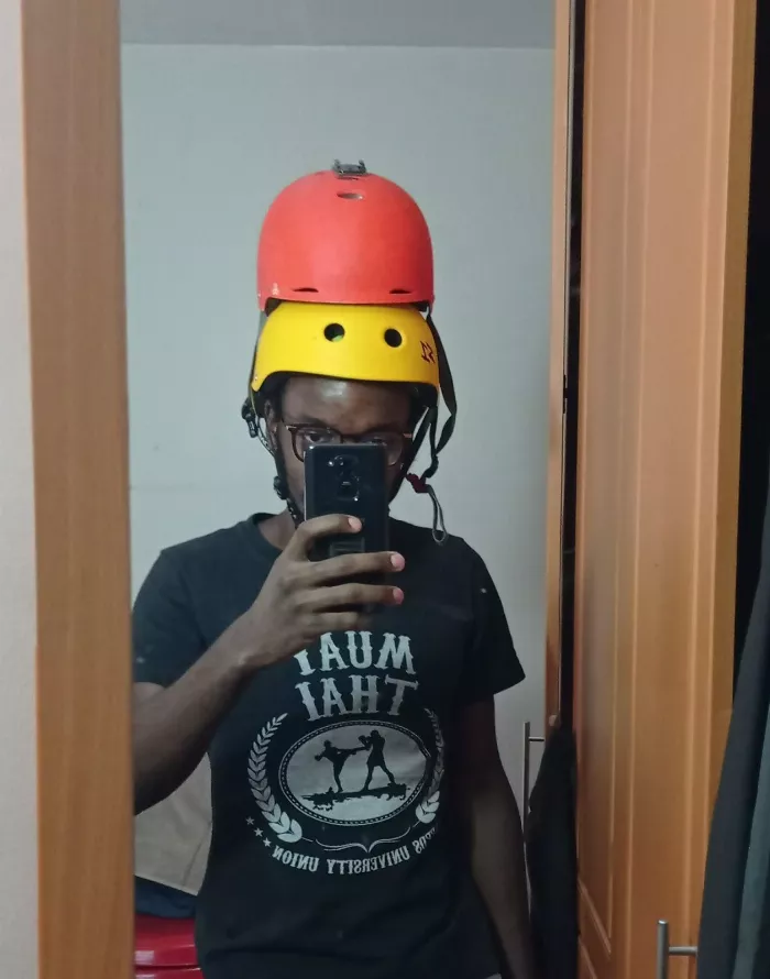 longboarder wearing two helmets for maximum safety