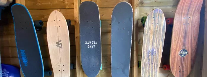 Longboards displayed on a wall using a rack system