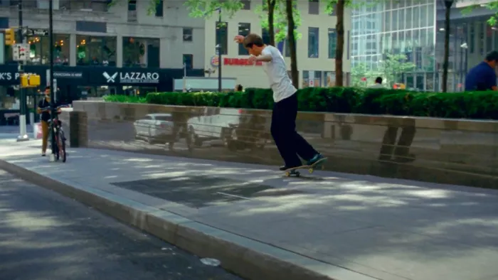 Mark Suciu captured in a dynamic mid-air skateboarding movement