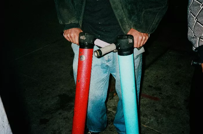 Nico Patino captured jumping high on a pogo stick at a NYC skate spot.