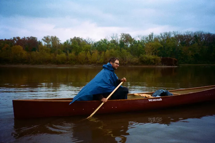 Patrick O'Dell canoeing down the Mississippi River with his dog.