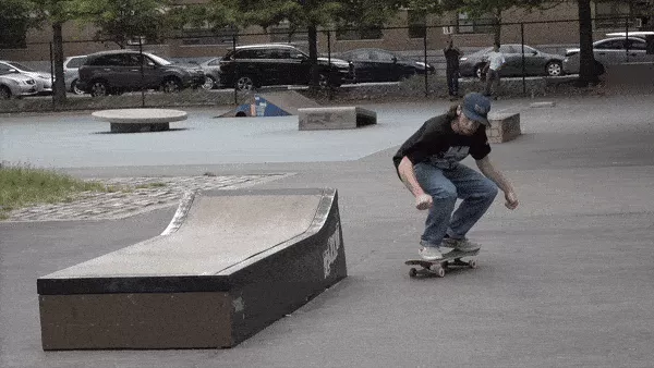 Person attempting a kickflip tailslide