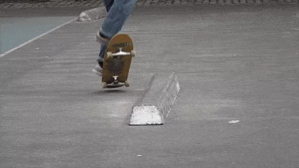 Person doing a 5050 grind on a ledge