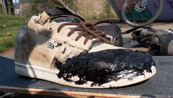 Repaired skate shoe using a combination of suede patch and glue