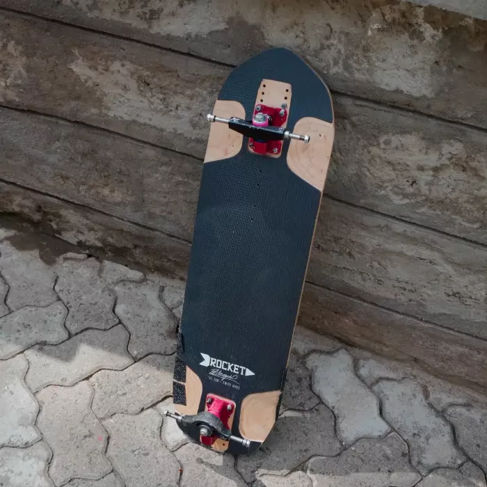 Rider on a longboard with Rogue ZM1 trucks