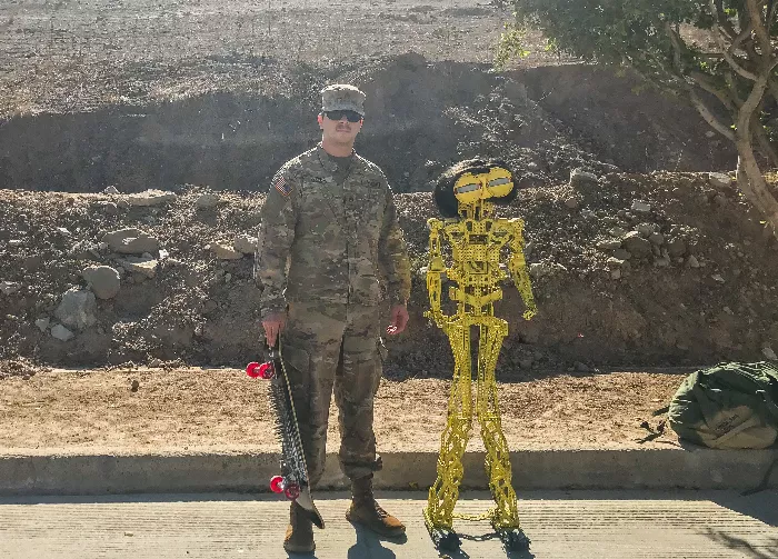 Saul Ojeda with a robot