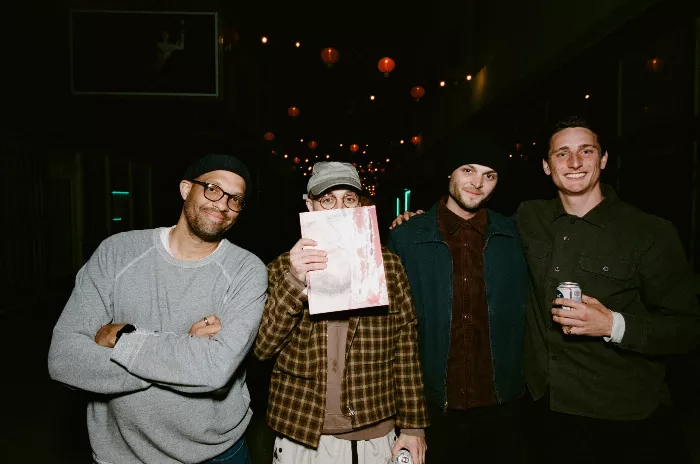 Scott Mackey and others at a meal before the Jenkem party