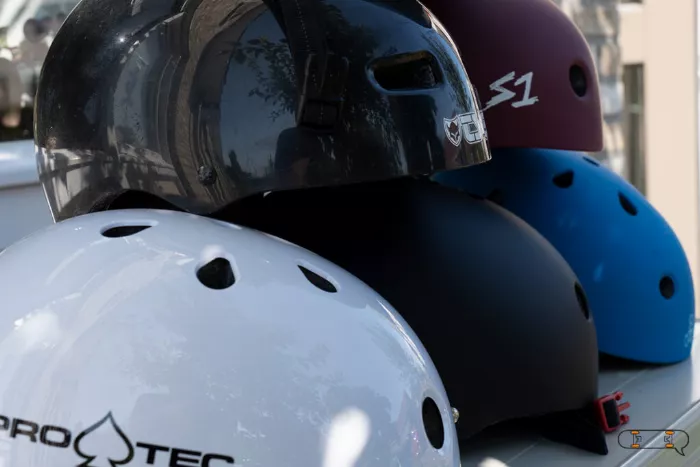 Several skateboard helmets are displayed, highlighting the importance of safety.