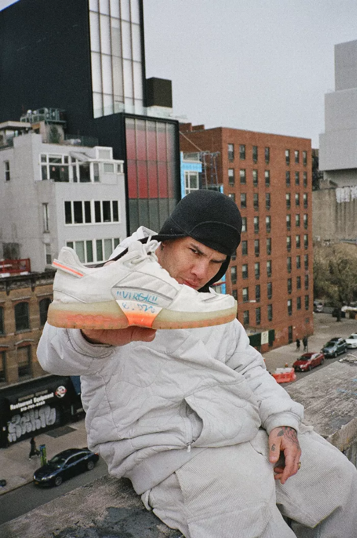 Shawn Powers performing a trick on his skateboard in NYC