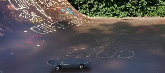 Skateboard deck on mini ramp