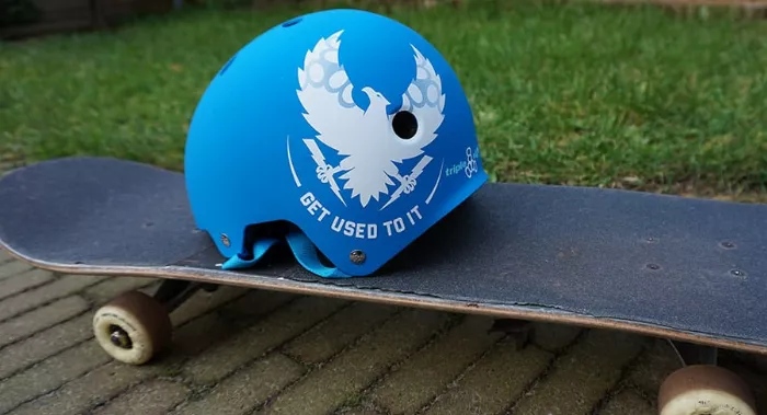 Skateboard helmet resting on a skateboard deck