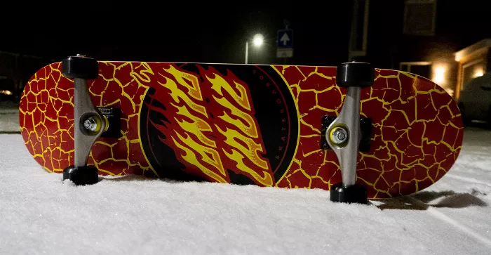 skateboard in the snow