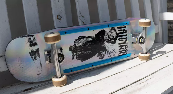 Skateboard with deck rails attached to the bottom, showcasing their position and function