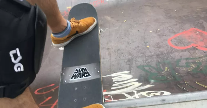 skateboarder doing a drop in