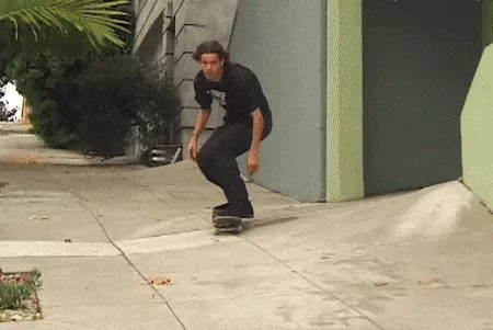 Skateboarder going for a hill bomb gif