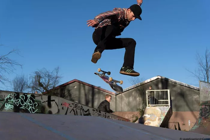 Skateboarder performing a kickflip