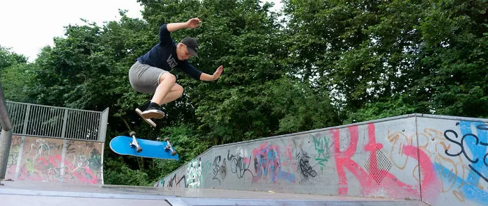 Skateboarder performing an intermediate trick