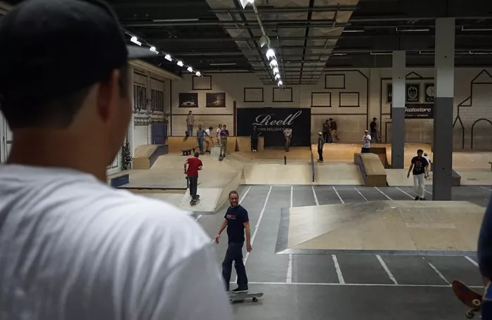 skateboarders practicing in a skatepark