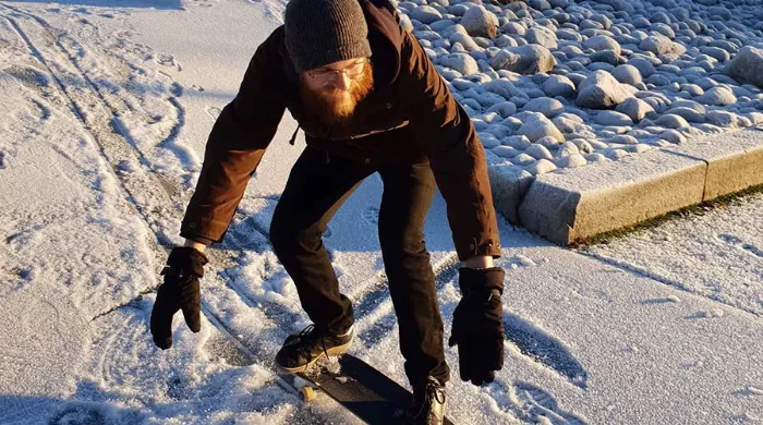 skateboarding in the winter snow