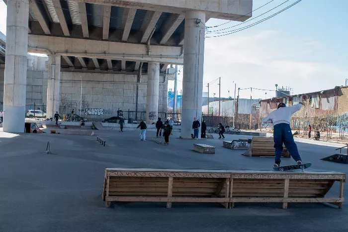 Skater performing a trick on the stairs at K Bridge Park