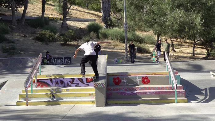 Skaters engaging in conversation at El Sereno Skate Park in Los Angeles