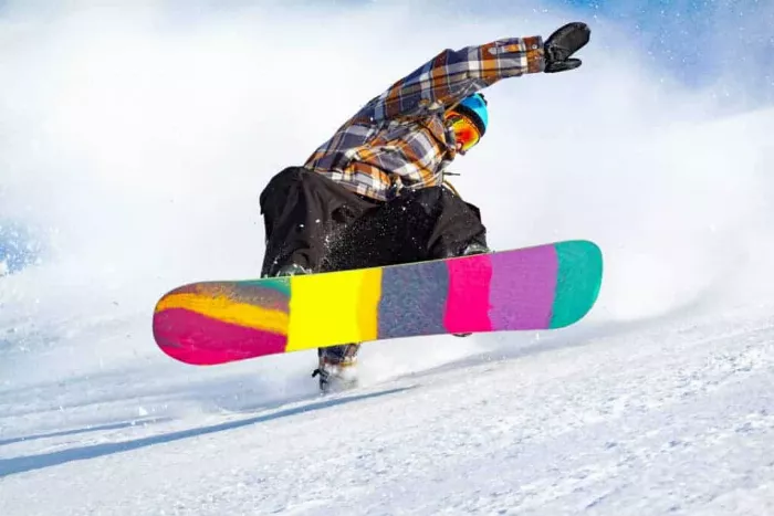 Snowboarder executing a trick mid-air