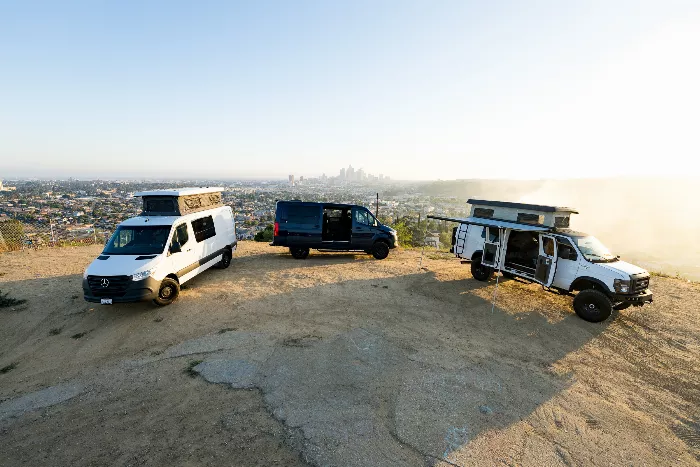 TJ Gaskill standing near a converted van in a city setting